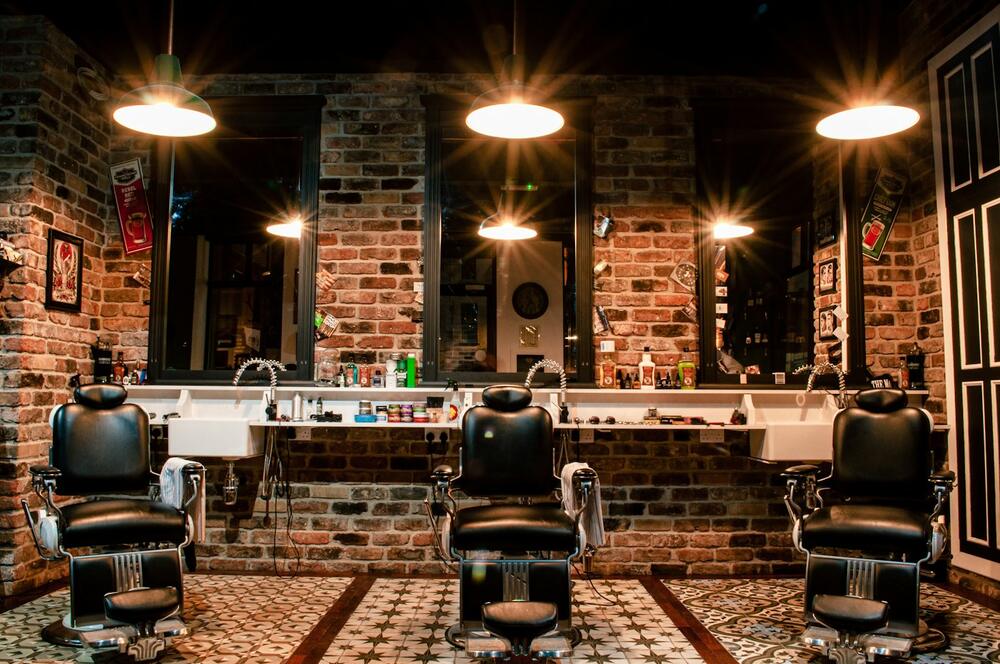 Classic barbershop with leather chairs and warm lights